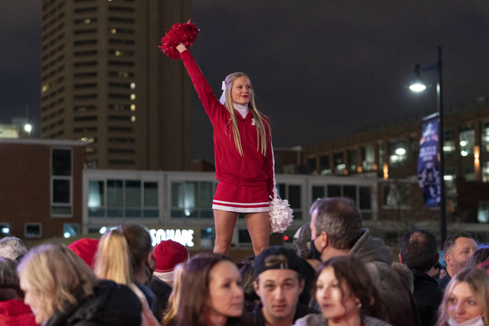 Fans wait for the arrival of the Wisconsin and Nebraska women's volleyball teams prior to the championship match of the NCAA women's college volleyball tournament, Saturday, Dec. 18, 2021, in Columbus, Ohio. (AP Photo/Jeff Dean)