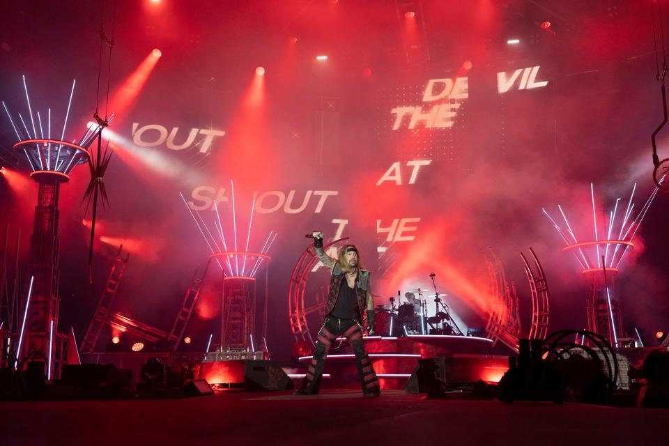 Mötley Crüe frontman Vince Neil and drummer Tommy Lee perform their hit “Shout at the Devil” during a performance at Lucas Oil Stadium on Sunday, Aug. 16, 2022, in Indianapolis. The band has sold over 100 million albums worldwide. 