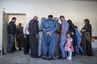 <p>Voters head to polling stations to cast their vote for the Iraqi parliamentary election on May 12, 2018 in Erbil, Iraq. Citizens are voting in the first parliamentary elections since victory was declared over ISIS. (Photo: Younes Mohammed/Getty Images) </p>