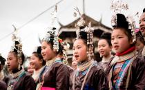<p>Villagers perform during a traditional celebration for the spring season in the village of Douzhai in Congjiang county, in southwest China's Guizhou province.</p>