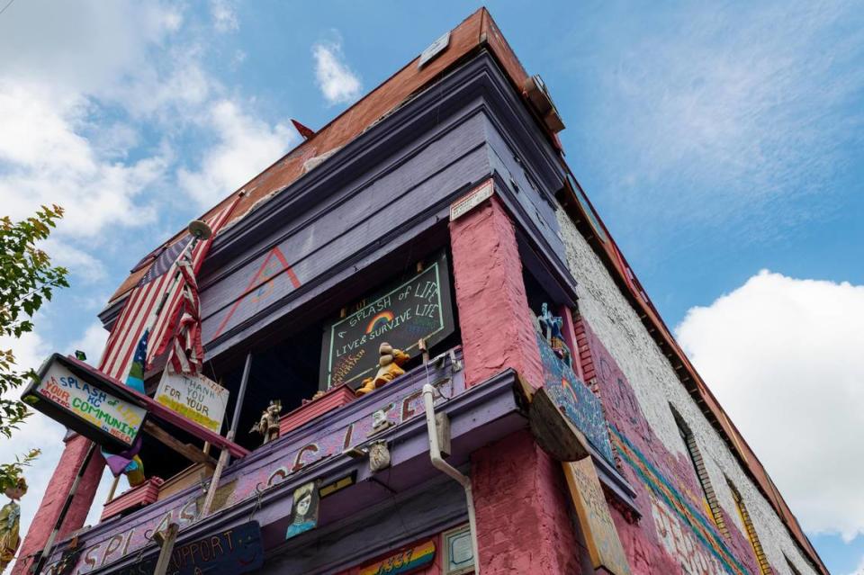 The iconic pink building on Troost Avenue in Kansas City will be removed from dangerous buildings list.