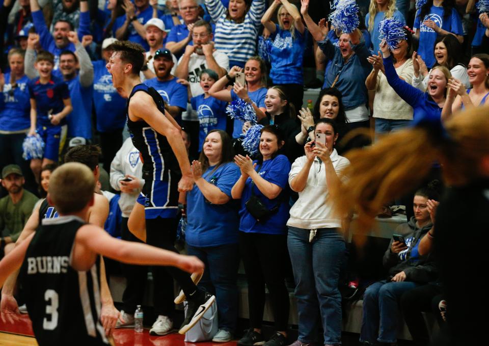 Spencer’s Camden Cox celebrates with his teammates after beating Simon Kenton in the KHSAA 8th Region Championship.