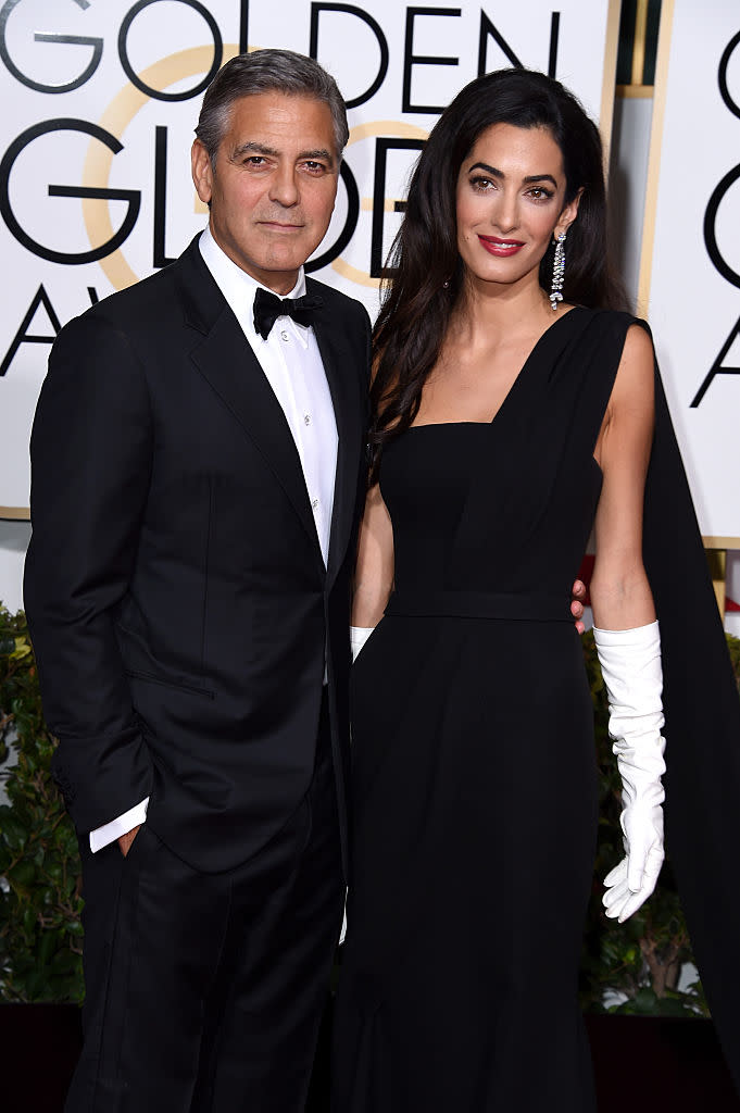 George Clooney and Amal Clooney walk the red carpet at he 72nd Annual Golden Globe Awards on Jan. 11, 2015. (Photo: Steve Granitz/WireImage)