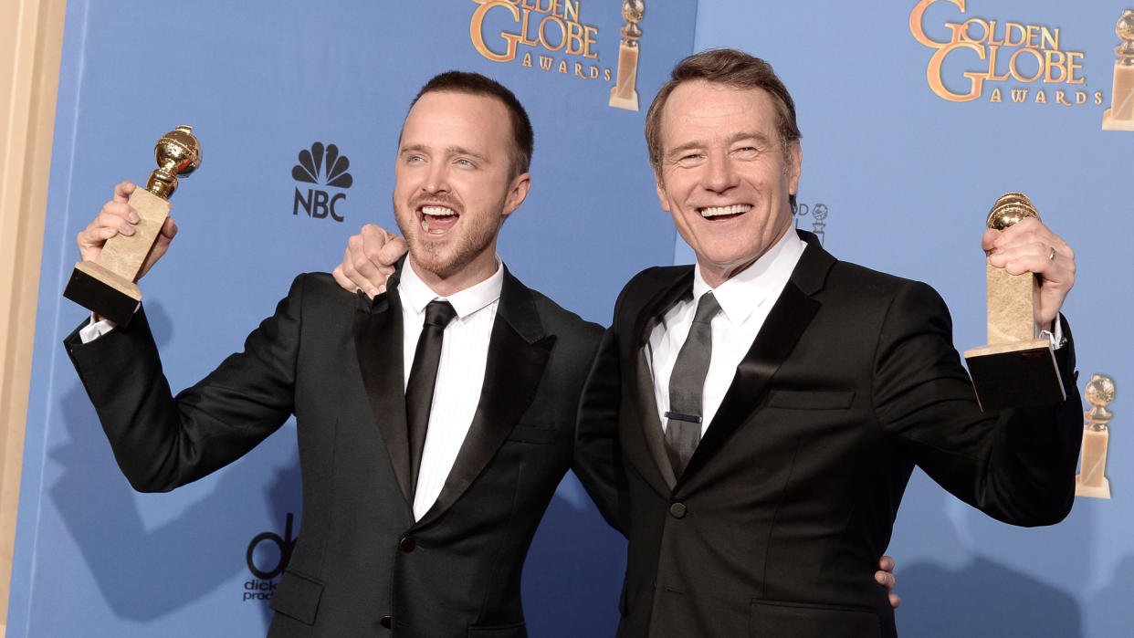 BEVERLY HILLS, CA - JANUARY 12:  Actors Aaron Paul (L) and Bryan Cranston, winners of Best Series - Drama for 'Breaking Bad,' pose in the press room during the 71st Annual Golden Globe Awards held at The Beverly Hilton Hotel on January 12, 2014 in Beverly Hills, California.