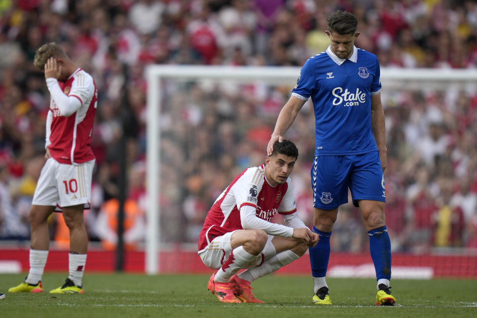 FILE - Everton's James Tarkowski consoles Arsenal's Kai Havertz at the end of the English Premier League soccer match between Arsenal and Everton at the Emirates stadium in London, on May 19, 2024. A fourth-straight Premier League title for Manchester City marks an unprecedented period of dominance by one team in English soccer. (AP Photo/Alastair Grant, File)