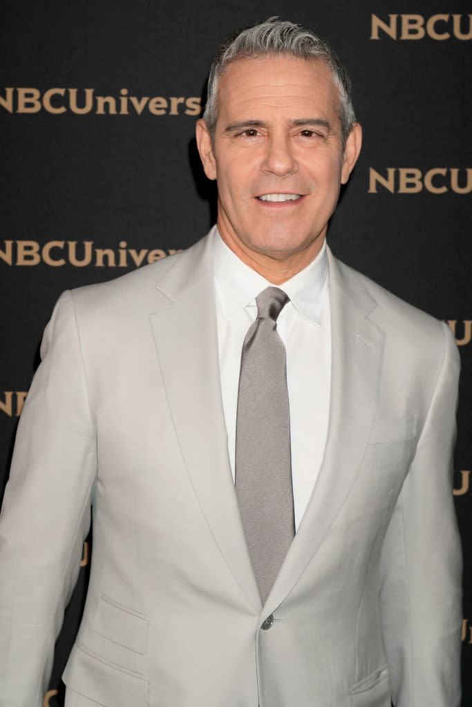 Andy in a light suit at an NBCUniversal event