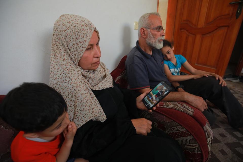 Ahlam al-Kurdi, second from left, is the paternal grandmother of a newborn baby delivered after her mother was killed by an airstrike in Rafah on April 20, 2024.