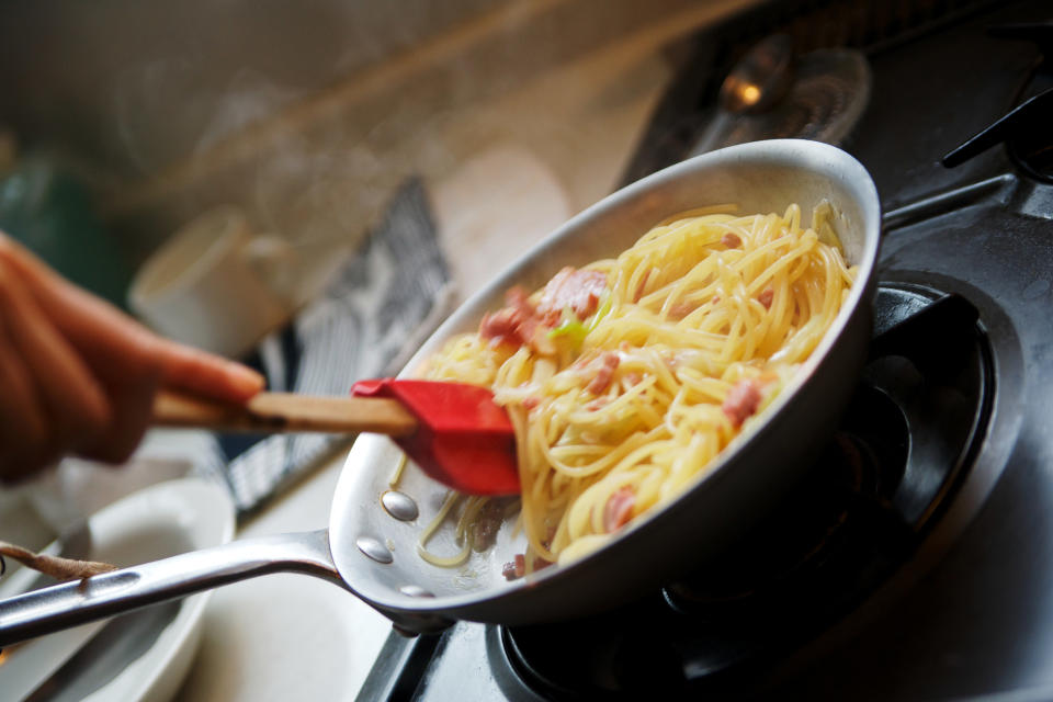 Cooking pasta on the stove top.