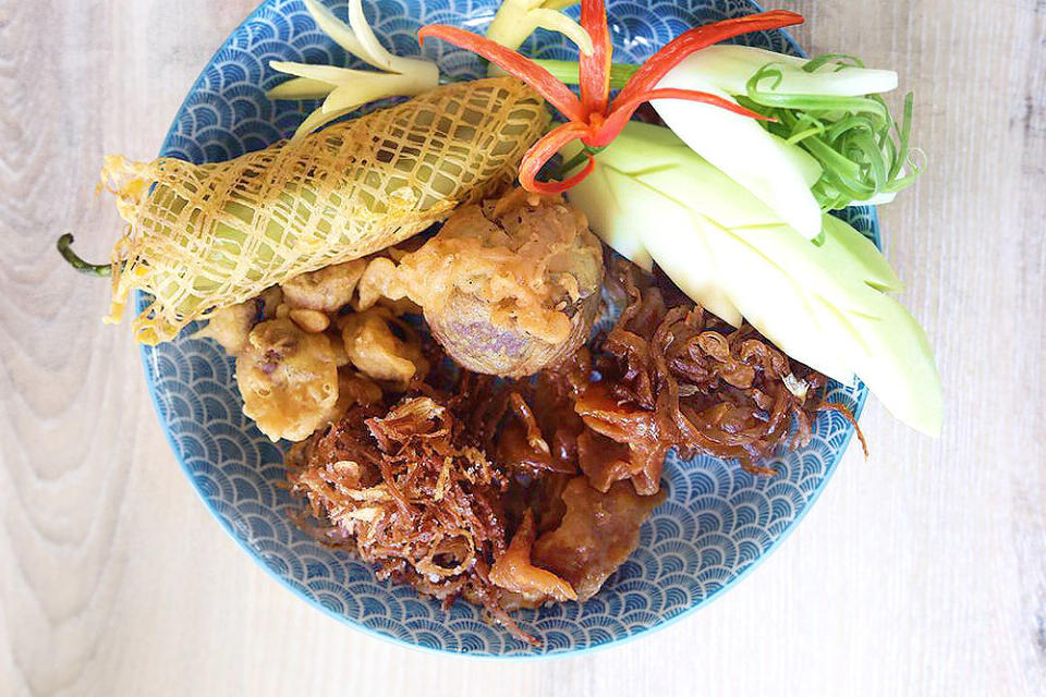 The full accompaniment of side dishes to go with 'khao chae.'