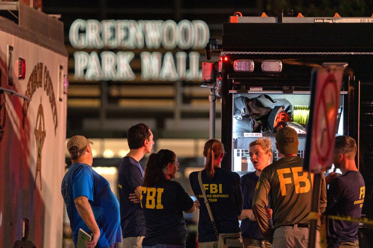 FBI agents gather outside Greenwood Park Mall after a shooting Sunday, July 17, 2022 at the mall.