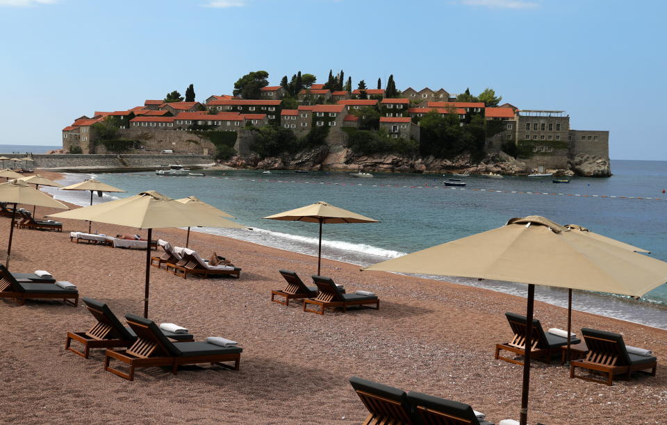 Pictured is beach near Sveti Stefan on the Adriatic coast of Montenegro, in 2019. Montenegro is the first European country to have no known active cases of coronavirus. Source: TASS/Getty Images