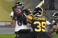 Pittsburgh Steelers free safety Minkah Fitzpatrick (39) breaks up a pass in the end zone to Baltimore Ravens tight end Luke Willson (82) as time runs out in first half of an NFL football game, Wednesday, Dec. 2, 2020, in Pittsburgh. (AP Photo/Don Wright)