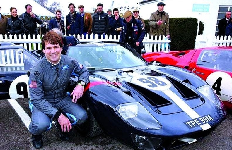 Ford CEO Jim Farley raced his 1965 GT40 at the Le Mans Classic in France in July and placed second. He is seen here with his race car at the Goodwood race in the U.K.