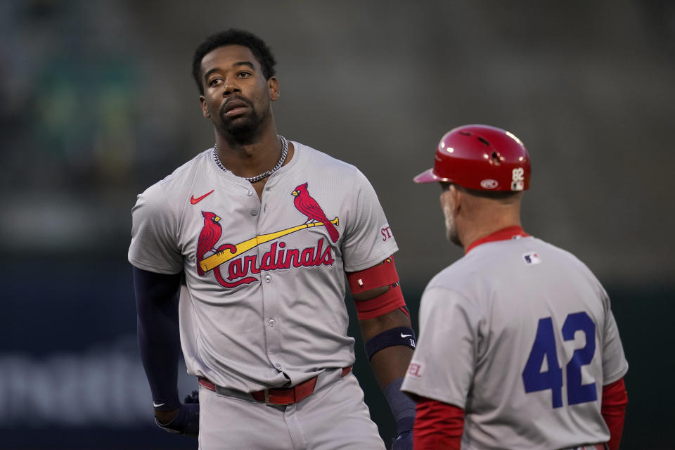 St. Louis Cardinals' Jordan Walker, left, reacts after hitting a fly ball to Oakland Athletics right fielder Lawrence Butler during the fourth inning of a baseball game Monday, April 15, 2024, in Oakland, Calif. (AP Photo/Godofredo A. Vásquez)