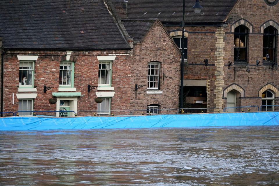 Buildings are seen behind temporary flood barriers in Ironbridge (Getty Images)