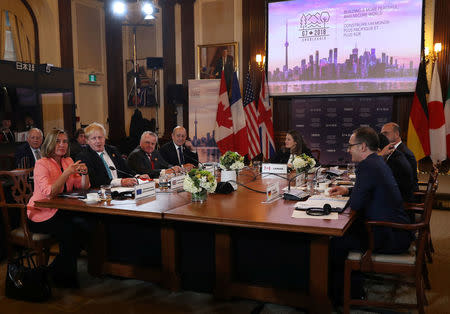 Canada's Minister of Foreign Affairs Chrystia Freeland is joined by France's Minister of Europe and Foreign Affairs Jean-Yves Le Drian, Acting U.S. Secretary of State John J. Sullivan, Britain's Foreign Secretary Boris Johnson, High Representative for the European Union's Foreign Affairs Federica Mogherini, Italy's Minister of Foreign Affairs Angelino Alfano, Japan's Minister of Foreign Affairs Taro Kono and Germany's Minister of Foreign Affairs Heiko Maas at opening remarks on the first day of foreign ministers meetings from G7 countries in Toronto, Ontario, Canada April 22, 2018. REUTERS/Fred Thornhill