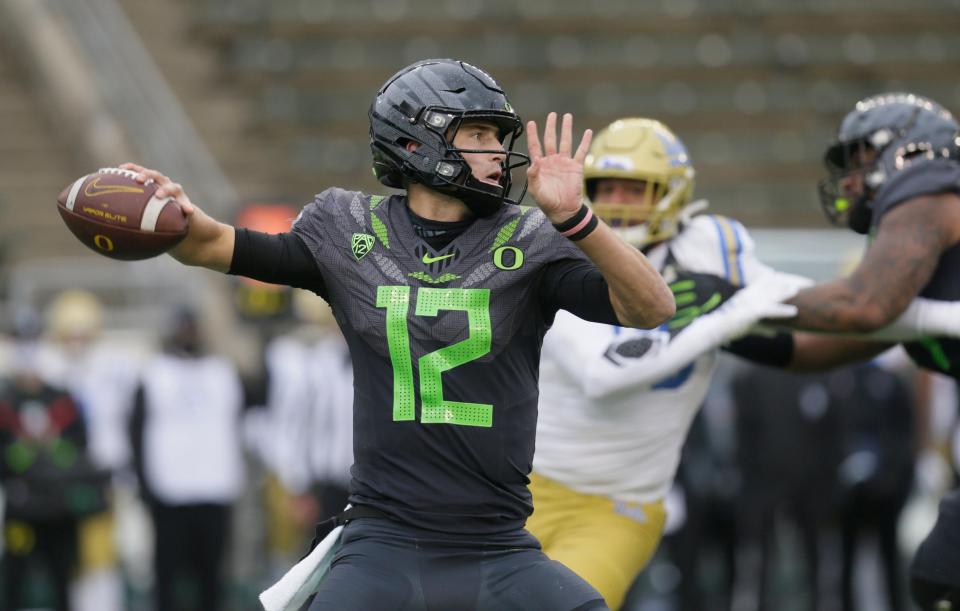 Oregon’s Tyler Shough throws down field against UCLA during the third quarter of an NCAA college football game in November 2020 in Eugene.