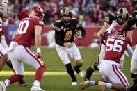 Missouri quarterback Connor Bazelak (8) runs the ball against Arkansas during the first half of an NCAA college football game Friday, Nov. 26, 2021, in Fayetteville, Ark. (AP Photo/Michael Woods)