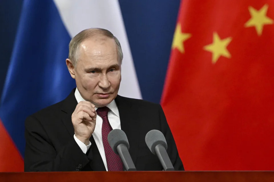 Russian President Vladimir Putin gestures as he talks with students of the Harbin Institute of Technology in Harbin, northeastern China's Heilongjiang Province, on Friday, May 17, 2024. (Sergei Guneyev, Sputnik, Kremlin Pool Photo via AP)