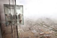 <p>At the Willis Tower observation deck, visitors float 1,353 feet above the Chicago skyline. The tower as a whole stands at 1,450 feet high with 110 stories.</p>