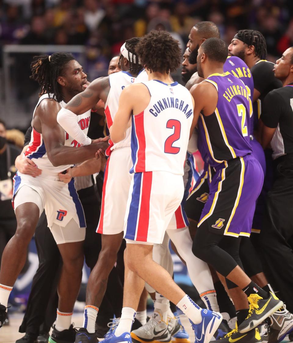 Detroit Pistons forward Isaiah Stewart, far left, goes after struck Stewart in the face during the third quarter of Sunday night's game.