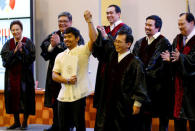 Elections officials declare Philippine boxing star Manny Pacquiao (centre L) as a senator, in Manila, Philippines May 19, 2016. REUTERS/Erik De Castro