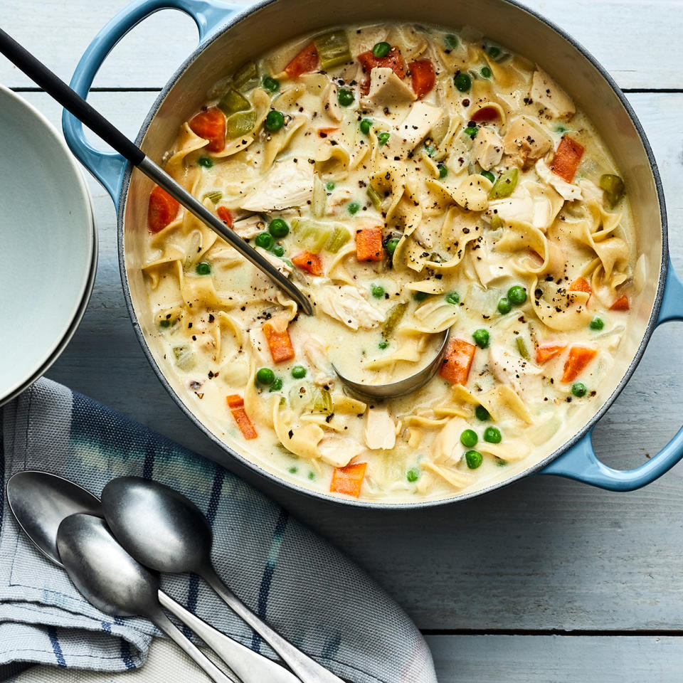 <p>This creamy chicken noodle soup recipe has a delicious pot pie feel to it. We call for rotisserie chicken to streamline your prep time—look for a nice big one with lots of breast meat on it. Pair this comforting and easy soup recipe with a green salad, or, if you're really hungry, a grilled cheese sandwich. <a href="https://www.eatingwell.com/recipe/275923/creamy-chicken-noodle-soup-with-rotisserie-chicken/" rel="nofollow noopener" target="_blank" data-ylk="slk:View Recipe;elm:context_link;itc:0;sec:content-canvas" class="link ">View Recipe</a></p>