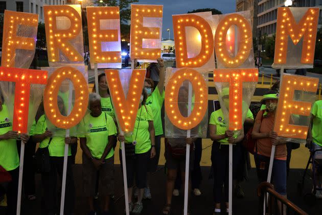 Voting rights activists during a candlelight vigil marking the first anniversary of Rep. John Lewis' (D-Ga.) death and advocating for the passage of voting rights legislation he helped to write. (Photo: Alex Wong via Getty Images)