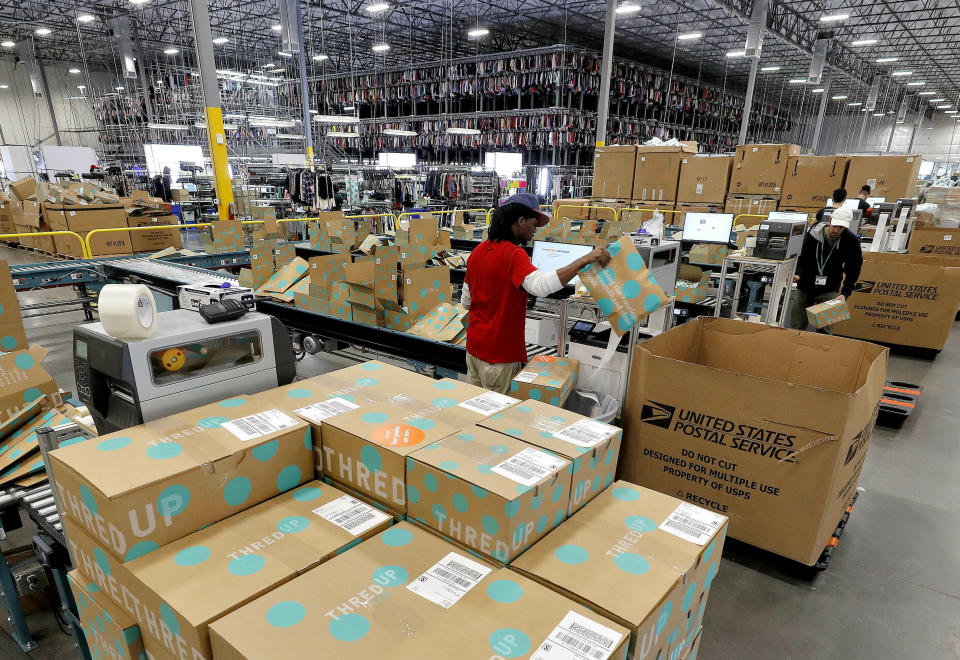 In this Tuesday, March 12, 2019, photo Andre Hill prepares clothing for shipment at the ThredUp sorting facility in Phoenix. Charitable organizations like Goodwill have cited how Marie Kondo’s popular Netflix series, “Tidying up with Marie Kondo” has led to a surge of donations. And sites like OfferUp and thredUP also note an uptick in the number of items being sent to them for sale. (AP Photo/Matt York)