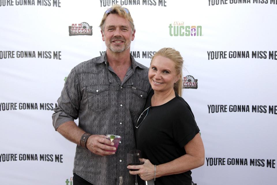 John Schneider and Alicia Allain attend 