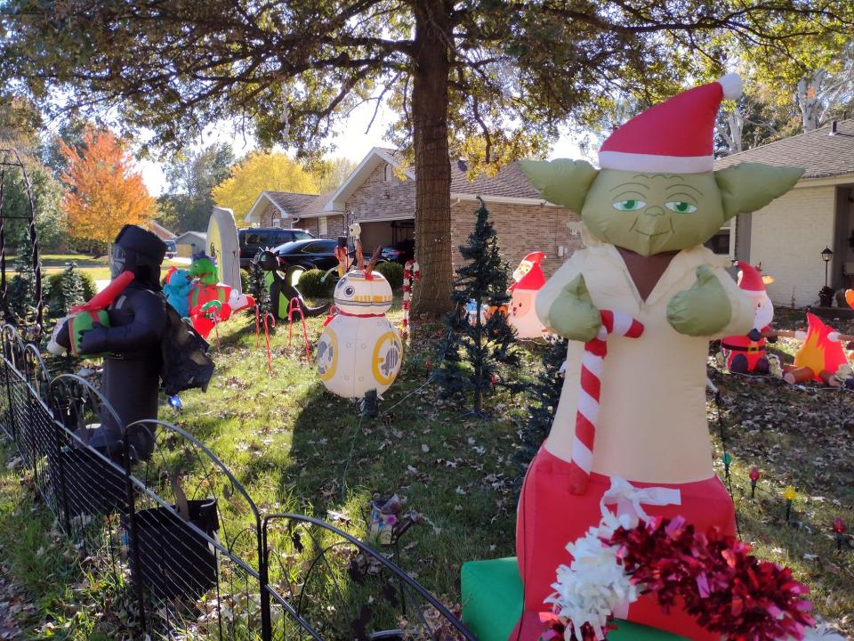 Christmas-themed Star Wars inflatables cover the front yard of 2633 S. National Ave. The display is on 5-10 p.m. Sunday through Thursday and 5-11 p.m. Friday and Saturday. The array of inflatables and other light-up decorations are synced to the radio station 93.1 FM.