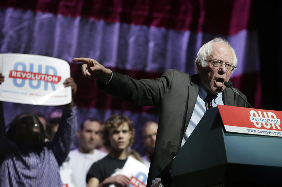 Sen. Bernie Sanders, I-Vt., addresses an audience during a rally Friday, March 31, 2017, in Boston. Sanders and Sen. Elizabeth Warren, D-Mass., made a joint appearance at the evening rally in Boston as liberals continue to mobilize against the agenda of Republican President Donald Trump. (AP Photo/Steven Senne)