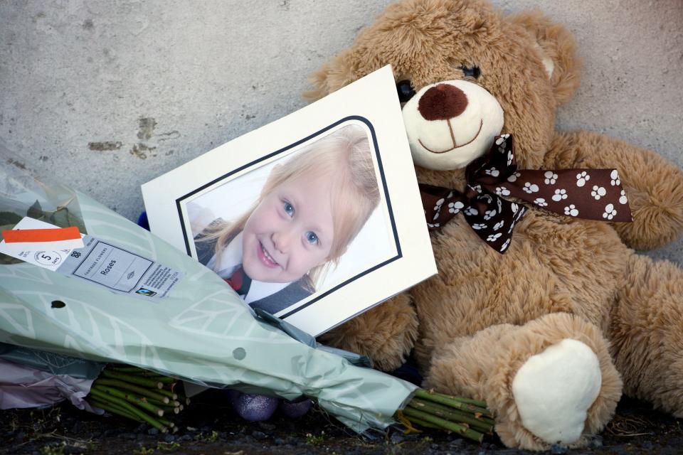 A picture among tributes near a house on Ardbeg Road on the Isle of Bute in Scotland, after the body of Alesha MacPhail was found in woodland (PA)