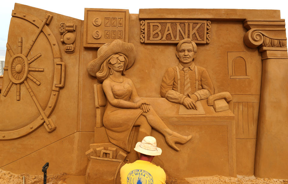 A sand carver works on a sculpture during the Sand Sculpture Festival "Dreams" in Ostend, Belgium June 18, 2019. (Photo: Yves Herman/Reuters)