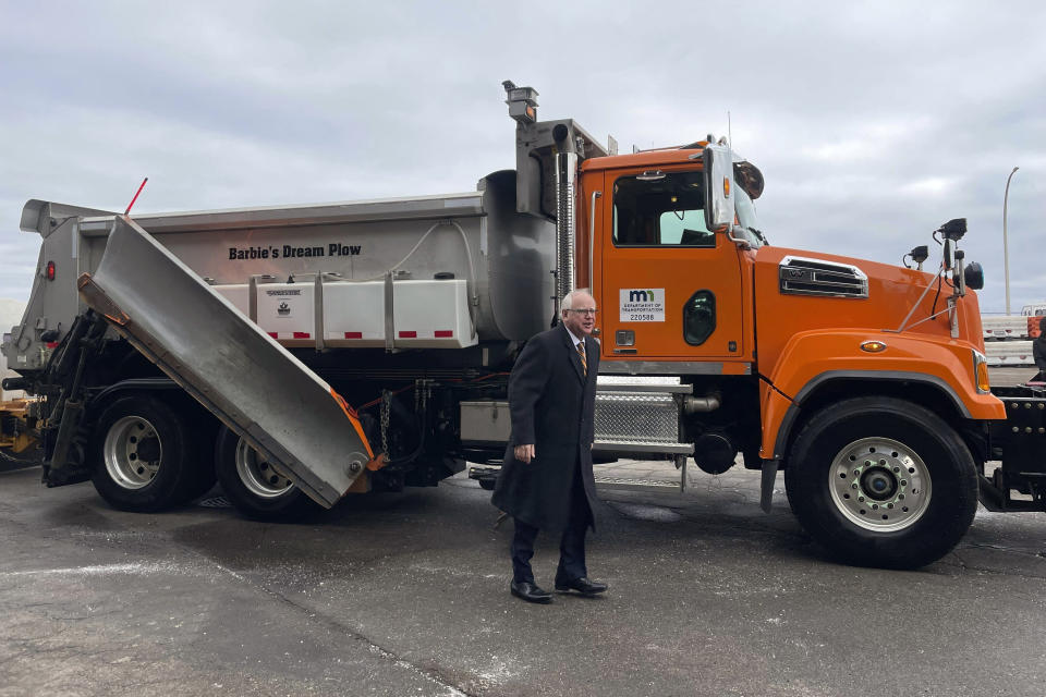 Minnesota Gov. Tim Walz smiles after a ride in a snowplow named "Barbie's Dream Plow", Tuesday, Jan. 30, 2024, in Richfield, Minn. Barbie's Dream Plow was one of eight winning names in Minnesota's fourth annual Name a Snowplow contest. (AP Photo/Trisha Ahmed)