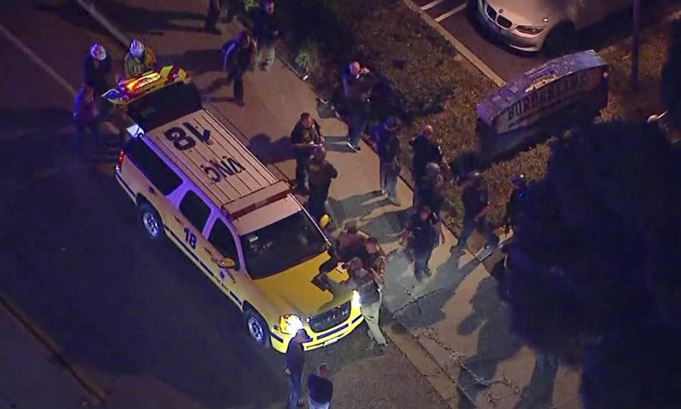 Officers around a police SUV in the vicinity of a shooting in Thousand Oaks, California, early Thursday morning local time. Source: AP