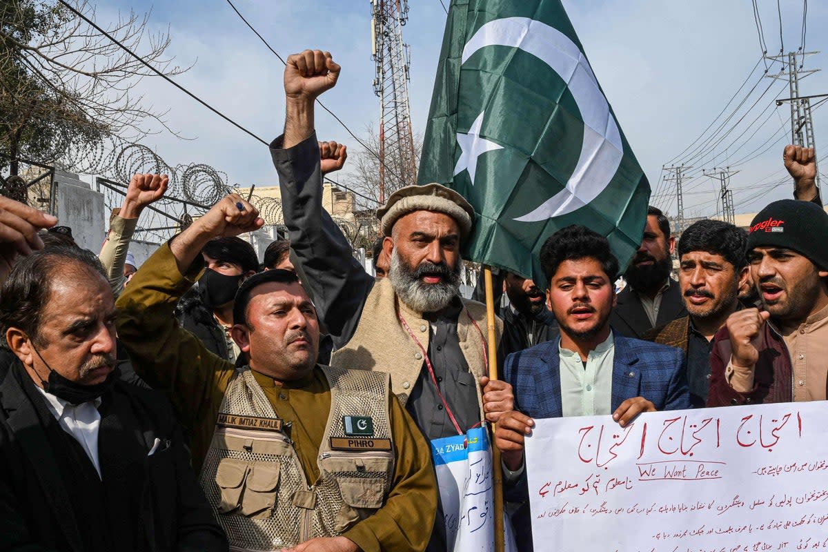 Family members of mosque blast victims and social activists chant slogans during a protest against the militancy and the mosque suicide blast inside a police headquarters in Peshawar (AFP via Getty Images)
