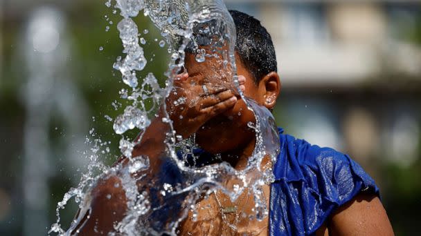 PHOTO: A boy refreshes himself in a fountain during hot weather as a heat wave hits Europe, in Brussels, Belgium, July 19, 2022. (Yves Herman/Reuters, FILE)
