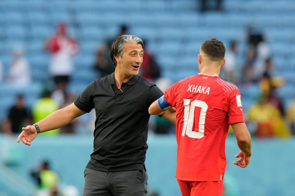 Switzerland head coach Murat Yakin, left, celebrates victory (Luca Bruno/AP) (AP)