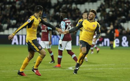 Britain Football Soccer - West Ham United v Arsenal - Premier League - London Stadium - 3/12/16 Arsenal's Alex Oxlade-Chamberlain celebrates scoring their fourth goal Action Images via Reuters / John Sibley Livepic