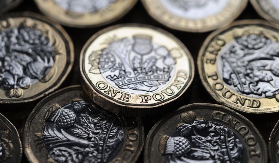 BRITISH ONE POUND COINS RE THE ECONOMY WAGES INTEREST RATES MORTGAGES INFLATION LENDING ETC UK