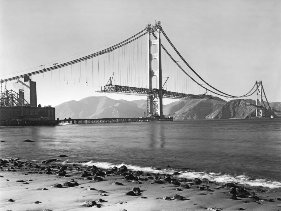 Construction of the Golden Gate Bridge with the roadbed being installed, San Francisco, California, 1937