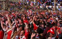 Chilean soccer fans react after winning the Copa America 2015 final soccer match between Chile and Argentina at a fan fest in Santiago, Chile, July 4, 2015. REUTERS/Mariana Bazo