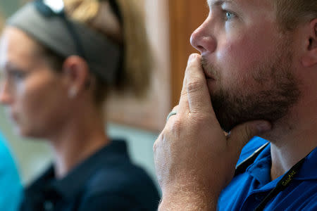 A representative of Pioneer-DuPont Seed listens to a group of grain buyers from Sri Lanka at the Pioneer-DuPont Seed facility in Addieville, Illinois U.S., September 19, 2018. Picture taken September 19, 2018. REUTERS/Lawrence Bryant