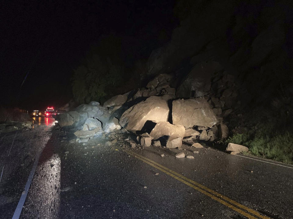 This Tuesday, March 5, 2019 photo released by the The California Highway Patrol shows a closed road due to multiple large boulders blocking California State Route 178 in the Canyon area in the mountains northeast of Bakersfield, Calif. Caltrans is estimating SR-178 will be closed for a couple of days as boulders are still falling onto the roadway. CHP reported numerous incidents of roadway flooding in the mountains northeast of Bakersfield and in areas of the San Joaquin Valley, as well as in the Owens Valley at the foot of the Eastern Sierra and in Death Valley National Park. (California Highway Patrol via AP)