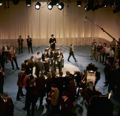 <p>Michael Ochs Archive/Getty</p> The Beatles from the balcony of CBS Studio 50, February 1964
