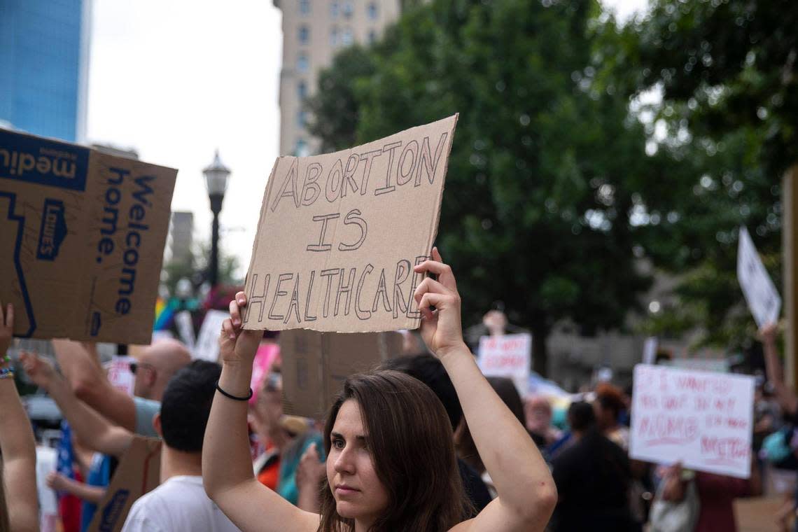 People gather near Robert F. Stephens Courthouse Plaza in downtown Lexington, Ky., on Friday, June 24, 2022 to protest the U.S. Supreme Court’s overturning of Roe v. Wade.