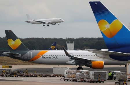 Airplanes with the logos of air carrier Condor by Thomas Cook are seen at the airport in Frankfurt