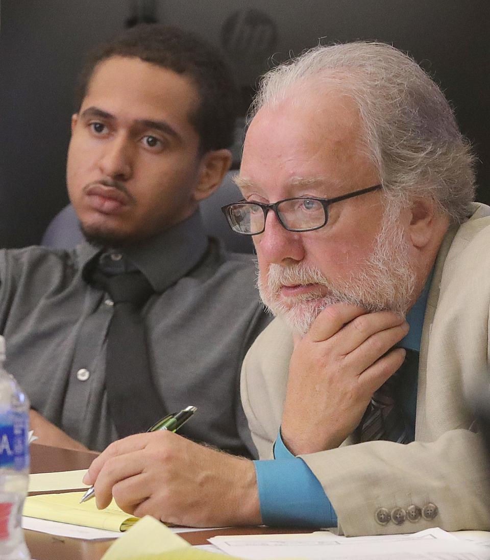 Eric Pursley, left, and his defense attorney Pat Summers view police body camera video during day one testimony in Judge Oldfield's Summit Count Court of Common Pleas on Wednesday, July 19, 2023 in Akron, Ohio. Pursley is charged in the October 2022 shooting death of his landlord Daniel Stein.