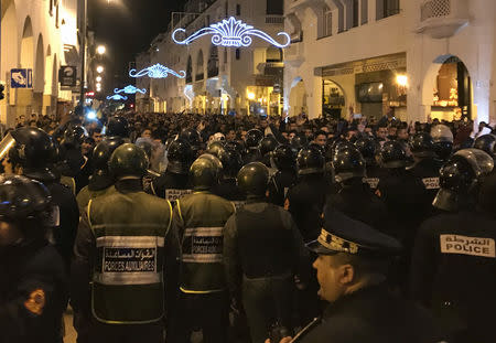 Police officers stand guard as young teachers protest for better work conditions in the capital Rabat, Morocco March 24, 2019. REUTERS/Ahmed ElJechtimi